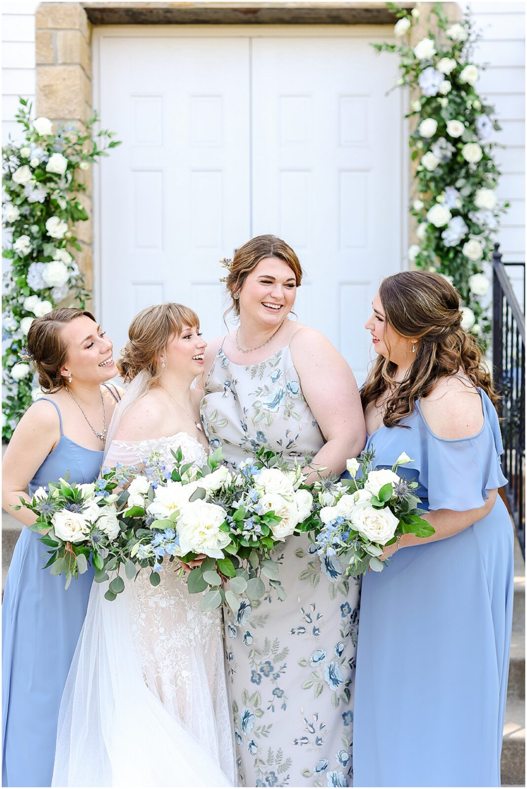 happy bridal party photos at the hawthorne house with blue and white flowers and theme - kansas city wedding photographer mariam saifan