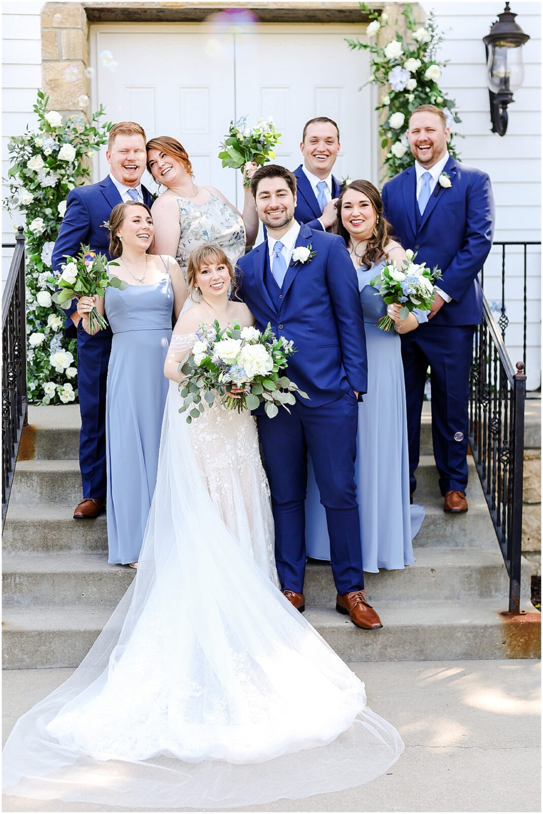 happy bridal party photos at the hawthorne house with blue and white flowers and theme - kansas city wedding photographer mariam saifan