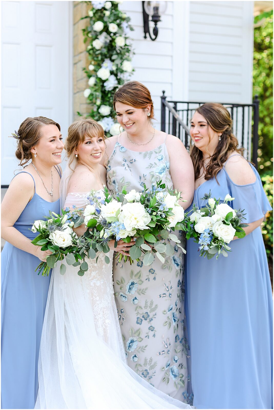 happy bridal party photos at the hawthorne house with blue and white flowers and theme - kansas city wedding photographer mariam saifan