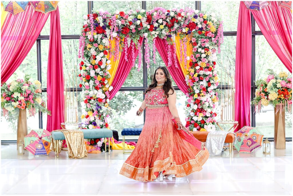 indian bride twirling around at her sangeet