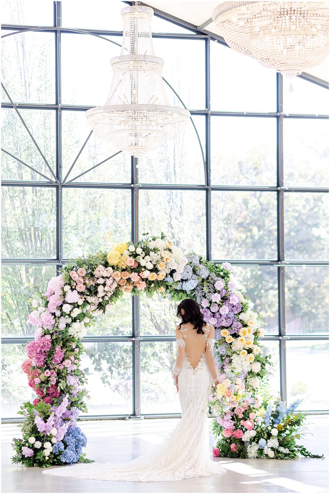 Beautiful colorful flower archway for wedding - lace mermaid wedding gown - wedding design ideas - colorful wedding flowers and wedding photography by Mariam saifan photography - avent orangery wedding photo and film