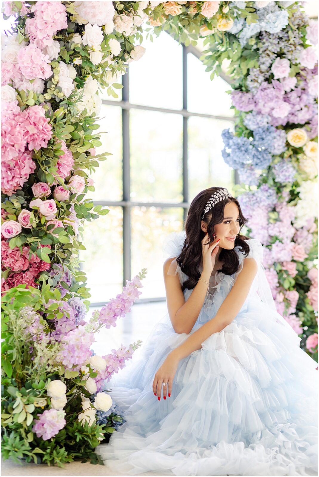 Light blue wedding dress - floral archway for wedding - gorgeous floral archway kansas city luxury wedding photographer Mariam Saifan Photography - Curated Gowns - wedding hair and makeup ideas - avent orangery - beautiful bridal photos - bridal photography - 30a florida wedding photography