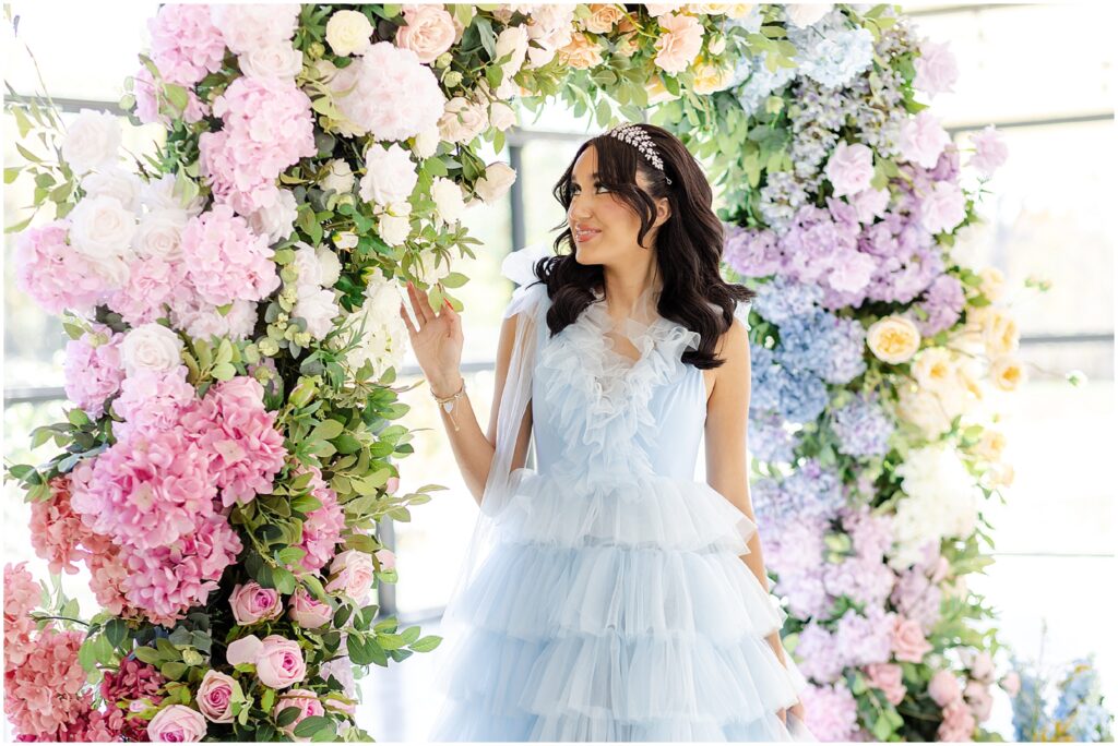 Light blue wedding dress - floral archway for wedding - gorgeous floral archway kansas city luxury wedding photographer Mariam Saifan Photography - Curated Gowns - wedding hair and makeup ideas - avent orangery - beautiful bridal photos - bridal photography - 30a florida wedding photography