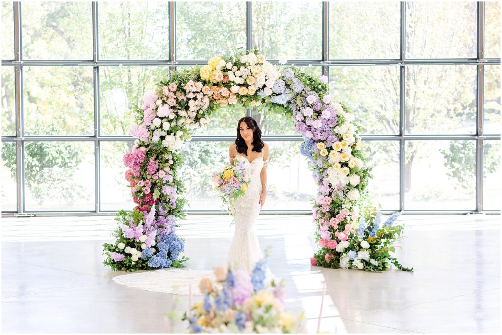 white lace wedding dress with long veil by the One Bridal in kansas city - Mariam Saifan Photography - luxury wedding photography based in KC and STL 30A Florida - Colorful pink flower arch for wedding - italian wedding theme - garden wedding theme  - avent orangery - hair by ezoza 