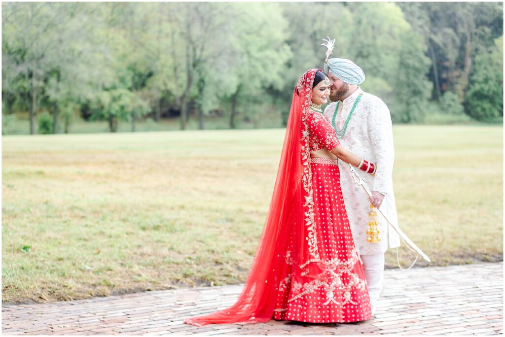 Elegant South Asian Bridal Portraits - Step into the Beauty of an Indian Fusion Sikh Wedding at Kansas Mildale Farms, including Sangeet, henna, baraat, dholi, through the Lens of Mariam Saifan Photography, Kansas City's Top Wedding Photographer - Langha 